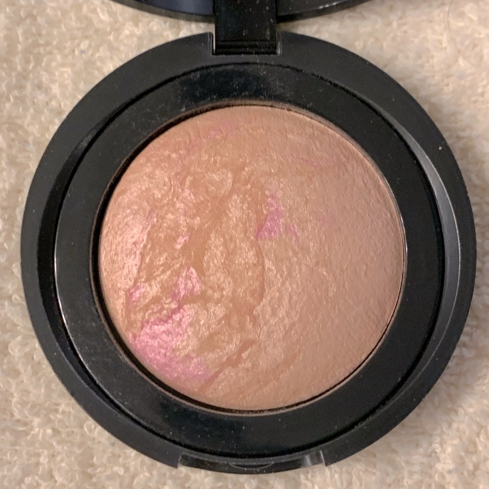 Laura Geller baked blush in Ethereal  Rose. Warm gold and pink tones.
